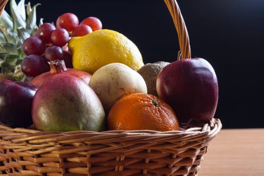 Bunch of exotic fruits in a big basket