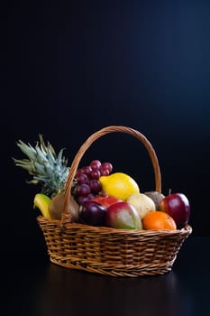 Bunch of exotic fruits in a big basket