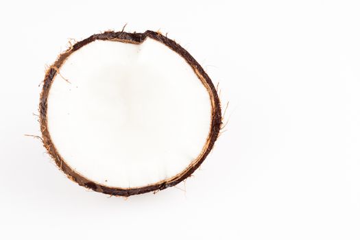 fresh brown coconut closeup on white background