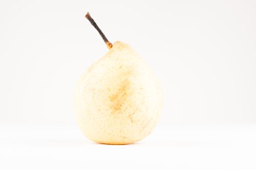 yellow bright helathy pear on white background