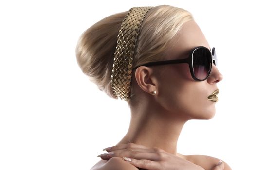 fashion portrait of young blond woman with hair style golden lips and wearing sunglasses over white