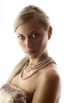 blond and pretty elegant and attractive woman with pearl necklace