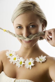 funny shot of cute girl playing with her twist braid