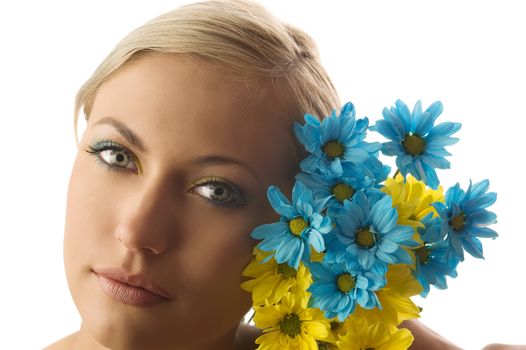 nice beauty portrait of pretty blond girl with blue and yellow daisy and colored makeup