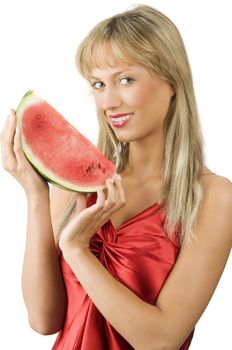 cute blond girl in red dress and red lips with a piece of water melon in the hands