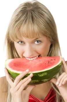 cute blond girl in red dress and red lips eating a piece of water melon