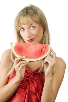 cute blond girl in red dress and red lips with a piece of water melon making face