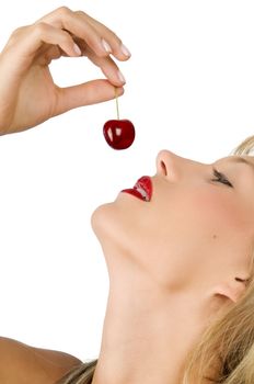 close up on of a sensual girl playing with her mouth with a cherry