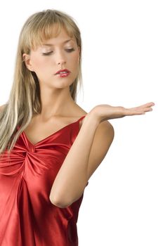 attractive and blond woman in red dress presenting a product on white