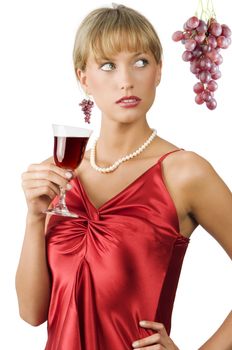 upscale or stylish lady in red dress with a glass of red wine with glancing eyes