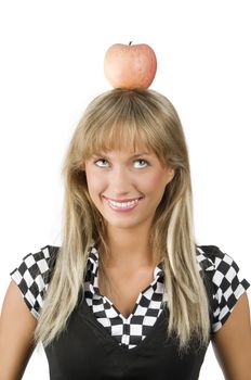 cute young girl with a red apple on her head making face