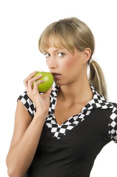 cute blond girl with a green apple on one hand near her mouth