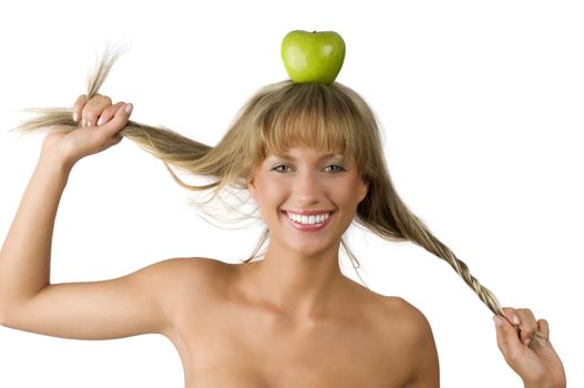 blond pretty woman with a green apple on her head and playing with hair