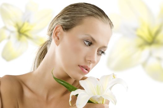 fresh young and beautiful woman with wet hair and a white lily