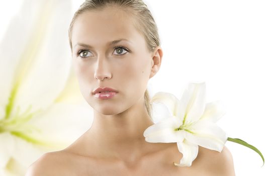 fresh portrait of a young and beautiful woman with a white lily