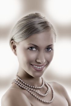 blond and pretty elegant and attractive woman with pearl necklace