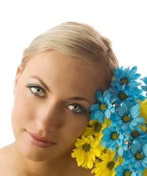 nice beauty portrait of pretty blond girl with blue and yellow daisy and colored makeup