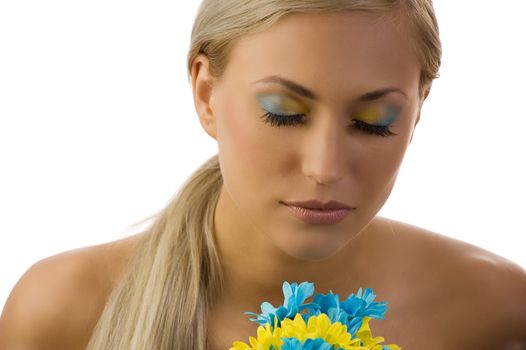 cute young woman with closed eyes and colored make up and daisy