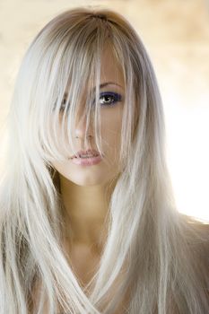 attractive blond girl with long hair in a fashion portrait