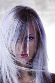 fashion portrait with forced colors of cute blond girl with long hair