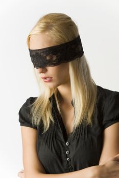 nice portrait of beautiful blond young girl with a black lace mask