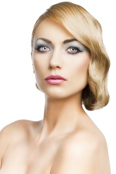 blond beautiful woman with strong make up and an old fashion hair stylish in beauty portrait close up, she is in front of the camera and looks in to the lens, she is in front of the camera and looks in to the lens.