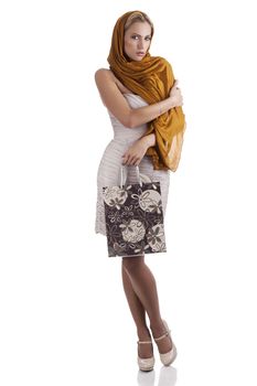 lovely elegant woman with scarf and flower textured shopping bag over white