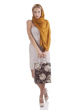 lovely alluring elegant woman with scarf and shopping bag over white