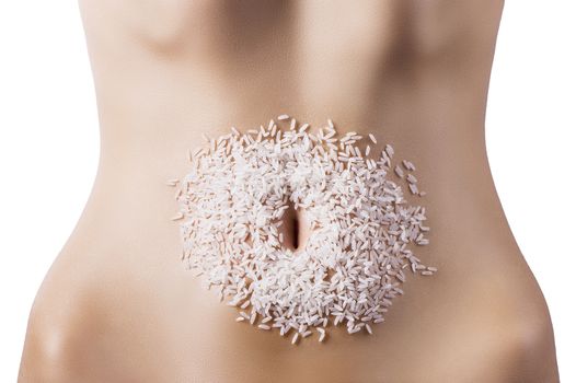 round composition of white rice around the navel