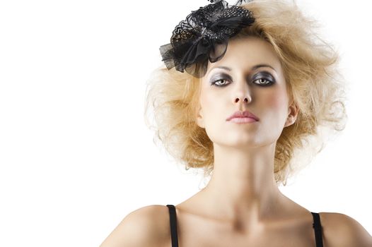 hair style with black accessory of a very beautiful blond girl wearing a black bra lingerie, she is in front of the camera and looks in to the lens with serious expression