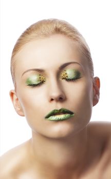 beauty young girl with a floral makeup. She is turned of three quarters and looks in to the lens with attractive expression