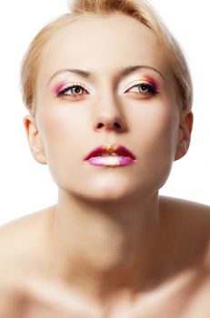 beauty young girl with a floral makeup. She is turned of three quarters and looks in to the lens with attractive expression