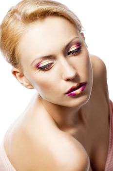 beauty young girl with a floral makeup. She is turned of three quarters and looks in to the lens with attractive expression