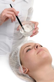 beauty salon, facial mask applying using brush