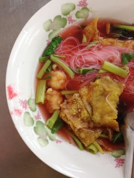 the dish of thai noodle with pork ball, yen ta fo