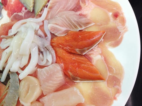 the shabu meat set with sliced pork, salmon, fish, squid and chicken