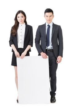 Business man and woman holding blank white board, full length portrait isolated on white background.