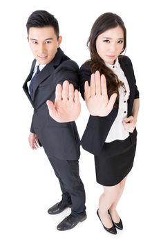 Business man and woman give you a gesture of stop, full length portrait isolated on white background.