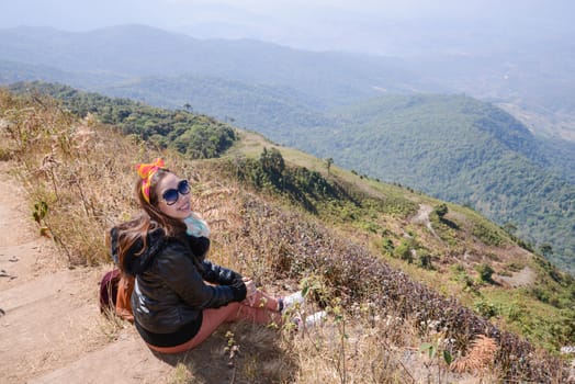 women on alpine savanna grassland of Doi Inthanon, Chiang Mai, Thailand