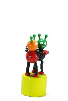 two of beatle dance ,wooden toy on white scene