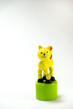 yellow wooden cat,toy on white scene