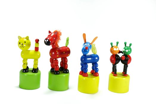 group of wooden colourful toys,on white scene