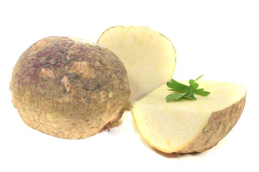 two rutabaga with parsley on a light background