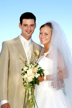 Happe wedding couple are smiling and looking
