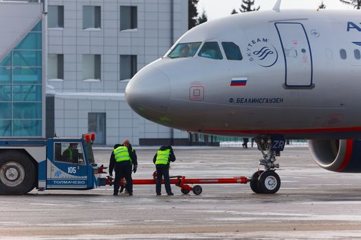 Towing jet airplane before take-off