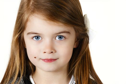 Six years old girl posing in the studio