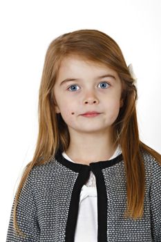 Six years old girl posing in the studio