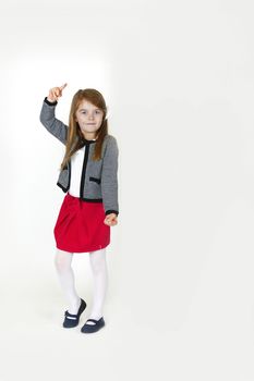 Six years old girl posing in the studio