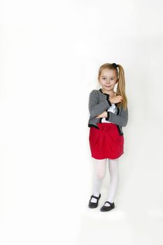 Six years old girl posing in the studio