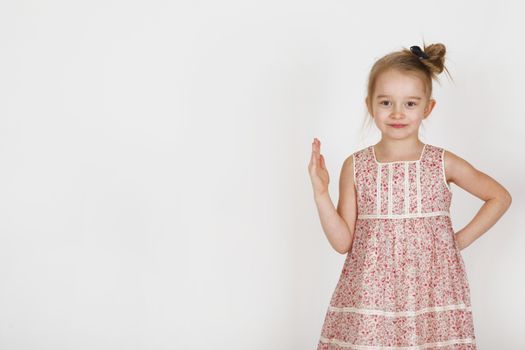 Six years old girl posing in the studio